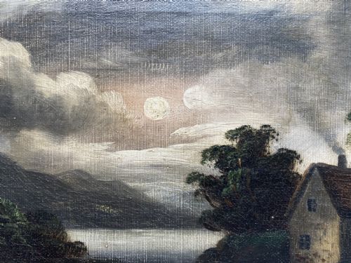 fig 6. An oil painting depicting a moonlit highland loch scene with a small cottage near the water, framed in a thick white painted wooden frame.