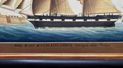 fig 4. An early 19th-century marine oil painting depicting a two-masted brig ship sailing into Malta harbour, set within a black and gilt wooden frame.