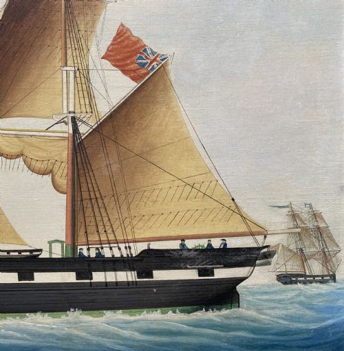 fig 5. An early 19th-century marine oil painting depicting a two-masted brig ship sailing into Malta harbour, set within a black and gilt wooden frame.