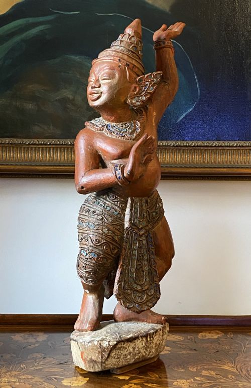 fig 2. A pair of 19th-century carved wooden Burmese Nat statues featuring a red painted finish, elaborate crowns, and glass mirror inlays.