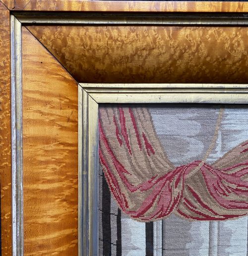 fig 2. An antique Biedermeier picture frame crafted from birds eye maple veneer with an inner gilt slip enclosing a needlework tapestry.