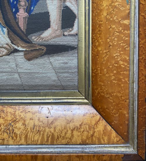 fig 5. An antique Biedermeier picture frame crafted from birds eye maple veneer with an inner gilt slip enclosing a needlework tapestry.