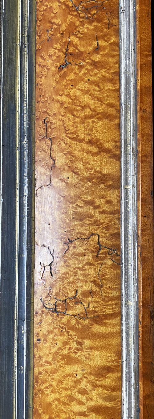 fig 7. An antique Biedermeier picture frame crafted from birds eye maple veneer with an inner gilt slip enclosing a needlework tapestry.