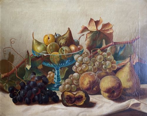 fig 1. An oil painting depicting a still life composition of grapes, pears, peaches, and figs arranged on a draped cloth with a blue glass pedestal dish, enclosed in a moulded gilt frame.