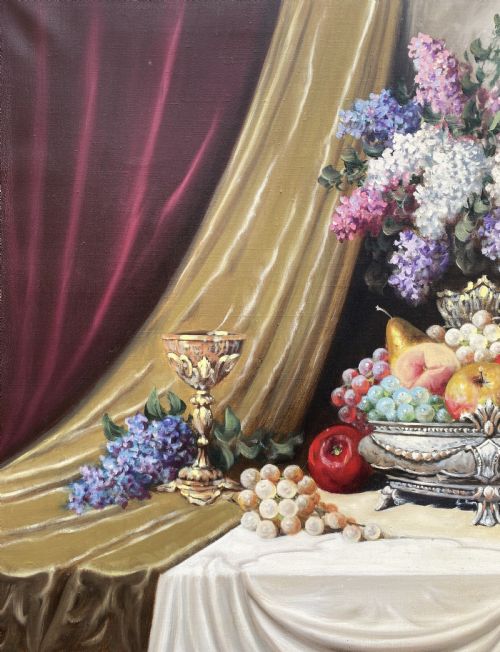 fig 5. A framed oil painting on canvas depicting a table with fruit, lilacs in a central vase, silver ewers, and draped gold and burgundy fabrics.
