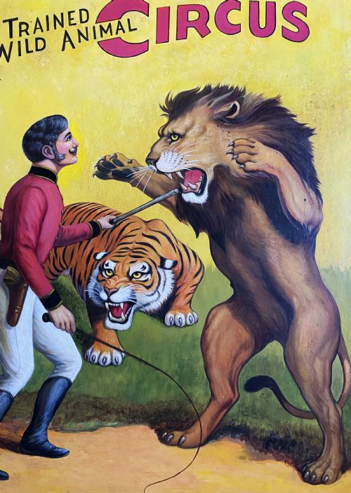 fig 4. A framed mid-twentieth-century oil painting depicting a lion tamer confronting a roaring lion and a tiger against a yellow background with bold red circus lettering.