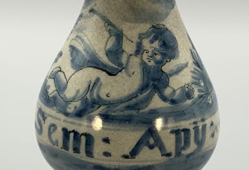 fig 3. Pair of 17th-century Italian Savona majolica apothecary bottles with cobalt blue hand-painted putti and Latin inscriptions over a tin-glazed ground.