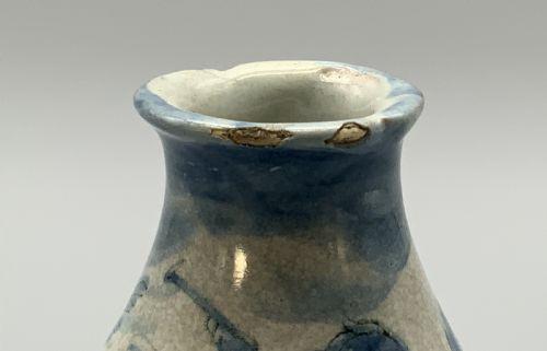 fig 6. Pair of 17th-century Italian Savona majolica apothecary bottles with cobalt blue hand-painted putti and Latin inscriptions over a tin-glazed ground.