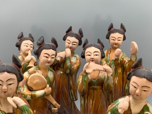fig 2. A set of seven Tang dynasty style lead-glazed earthenware figurines depicting standing female court musicians holding traditional instruments.