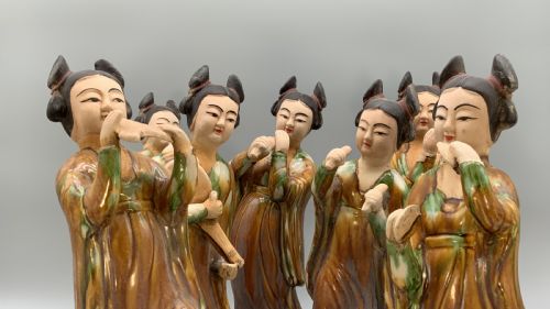 fig 5. A set of seven Tang dynasty style lead-glazed earthenware figurines depicting standing female court musicians holding traditional instruments.