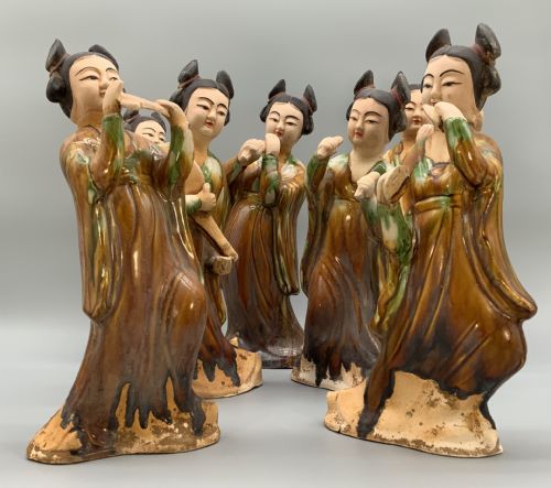 fig 6. A set of seven Tang dynasty style lead-glazed earthenware figurines depicting standing female court musicians holding traditional instruments.