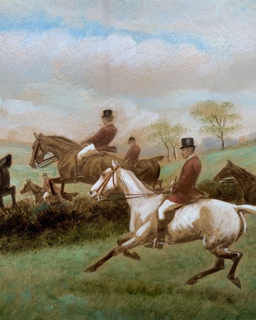 fig 4. An oil painting on board depicting horseback riders navigating a grassy field, housed in a decorative gilded frame.
