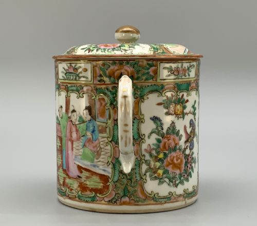 fig 4. A 19th-century Chinese export porcelain barrel-form coffee pot with cover, decorated with famille rose enamel figural reserves and floral patterns.