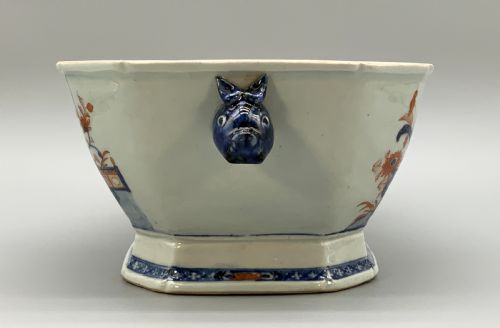 fig 4. An 18th-century Chinese export porcelain jardiniere decorated with hand-painted floral motifs in cobalt blue and iron-red with blue side handles.