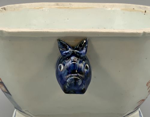 fig 5. An 18th-century Chinese export porcelain jardiniere decorated with hand-painted floral motifs in cobalt blue and iron-red with blue side handles.