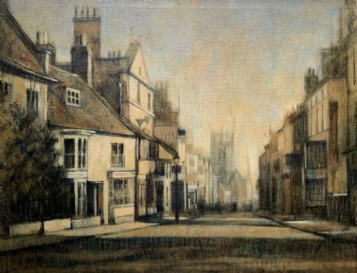 fig 1. A framed impressionist oil painting depicting a historic street scene with townhouses leading towards a church tower in muted brown, beige, and grey tones.