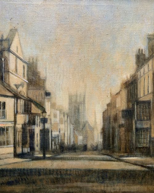 fig 3. A framed impressionist oil painting depicting a historic street scene with townhouses leading towards a church tower in muted brown, beige, and grey tones.