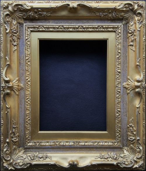 fig 1. An ornate 19th-century gold giltwood picture frame featuring intricate moulded gesso floral and shell embellishments around a central rectangular aperture.