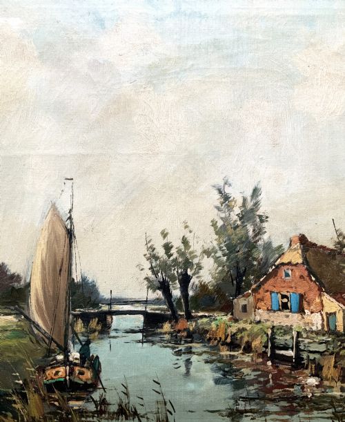 fig 4. An impressionist oil painting depicting a river scene with a sailboat, a cottage with blue shutters, and trees set in an ornate carved light cream frame.