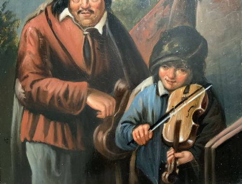 fig 5. An antique oil painting depicting two musicians, a man and a boy playing a violin, set in a wide wooden frame with a gilded inner moulding.