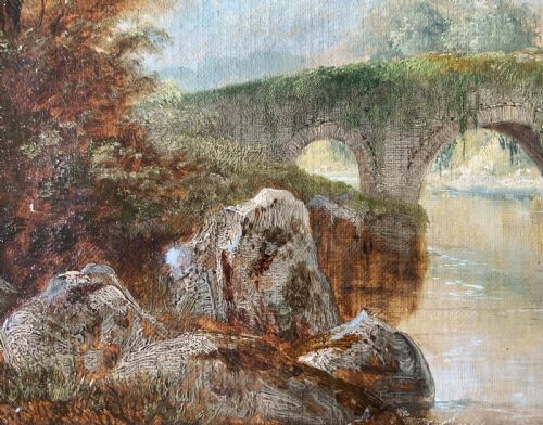 fig 7. A framed 19th-century oil painting depicting an arched stone bridge crossing a river amidst trees and distant mountains.