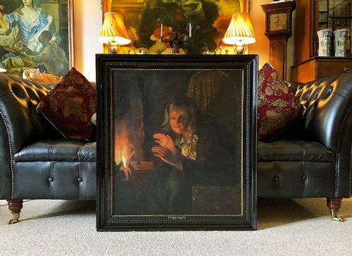 fig 1. A framed oil painting depicting a woman in historic dress warming her hands beside a glowing fire in a darkened interior.