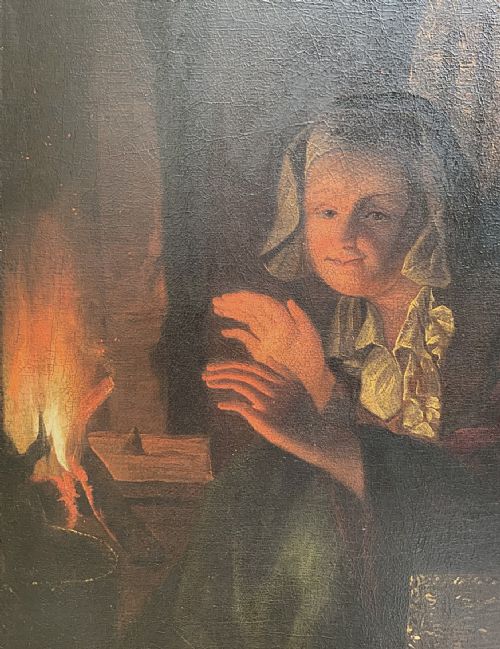 fig 4. A framed oil painting depicting a woman in historic dress warming her hands beside a glowing fire in a darkened interior.