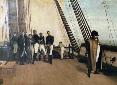 fig 4. A large horizontal oil painting depicting Napoleon Bonaparte standing on a wooden ship deck surrounded by naval staff.