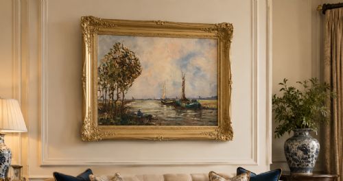 fig 2. An impressionistic Dutch canalscape oil painting depicting traditional barges alongside a grassy riverbank, housed in an ornate carved gold frame.