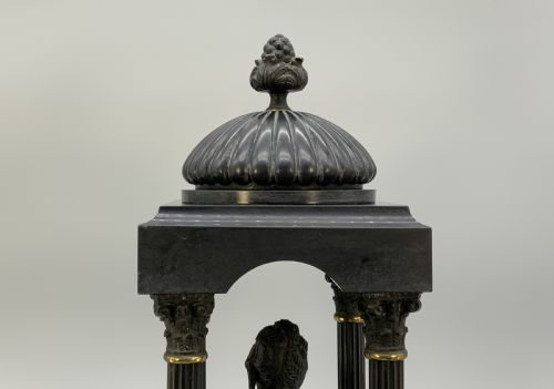 fig 8. A 19th-century patinated bronze and black marble classical domed temple featuring fluted columns and a central classical bust.