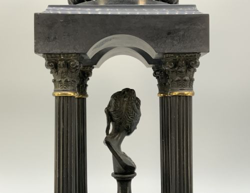 fig 9. A 19th-century patinated bronze and black marble classical domed temple featuring fluted columns and a central classical bust.