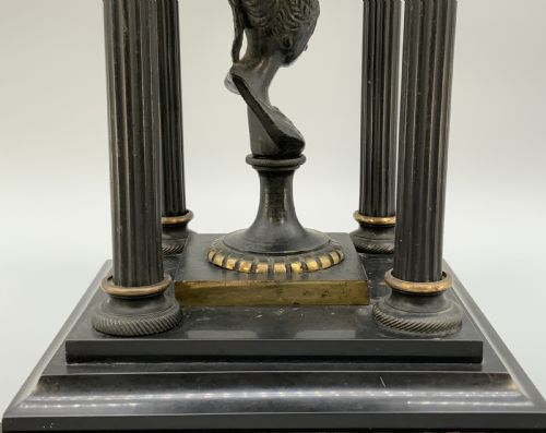 fig 10. A 19th-century patinated bronze and black marble classical domed temple featuring fluted columns and a central classical bust.