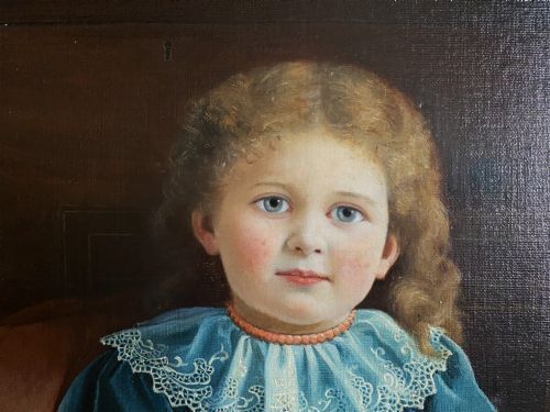 fig 5. An oil portrait on canvas depicting a young child in a blue dress seated in a wooden chair, enclosed within an ornate giltwood frame.