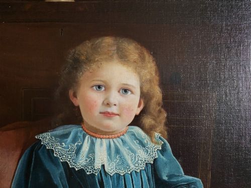 fig 6. An oil portrait on canvas depicting a young child in a blue dress seated in a wooden chair, enclosed within an ornate giltwood frame.