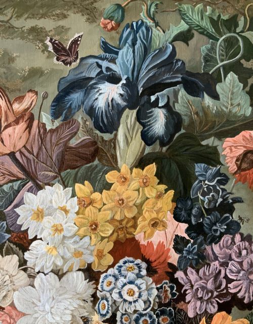 fig 7. A gilt-framed oil painting featuring a dense bouquet of colourful flowers in a classical urn alongside a birds nest with eggs.