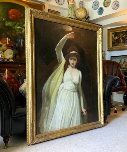 fig 3. A large gilt-framed Georgian oil painting on canvas depicting a woman in white classical drapery holding a torch against a dark background.