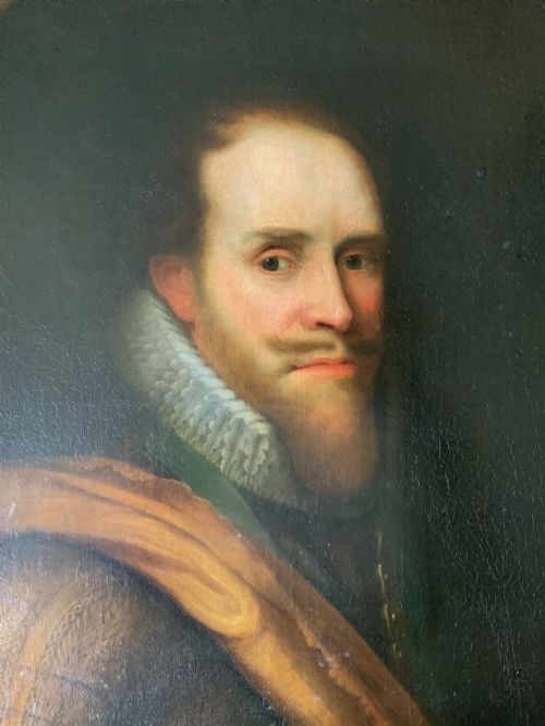 fig 3. A 17th-century Dutch Old Master oil portrait of a man with a beard, lace ruff, and armour, presented in a light-coloured moulded wooden frame.