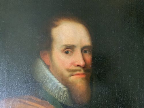 fig 4. A 17th-century Dutch Old Master oil portrait of a man with a beard, lace ruff, and armour, presented in a light-coloured moulded wooden frame.