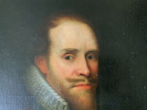 fig 5. A 17th-century Dutch Old Master oil portrait of a man with a beard, lace ruff, and armour, presented in a light-coloured moulded wooden frame.