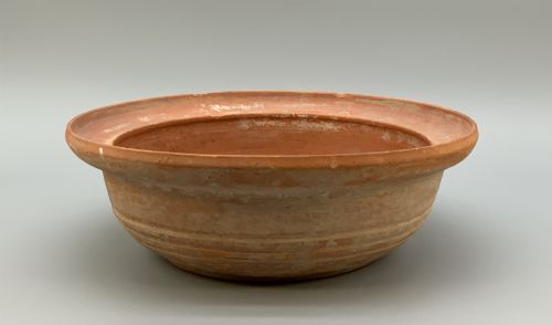fig 3. A pair of circular Han Dynasty red terracotta pottery basins featuring broad everted rims and horizontal exterior grooves.