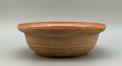 fig 4. A pair of circular Han Dynasty red terracotta pottery basins featuring broad everted rims and horizontal exterior grooves.