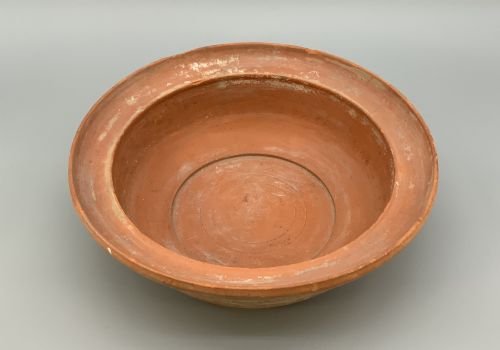 fig 5. A pair of circular Han Dynasty red terracotta pottery basins featuring broad everted rims and horizontal exterior grooves.