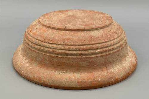 fig 6. A pair of circular Han Dynasty red terracotta pottery basins featuring broad everted rims and horizontal exterior grooves.