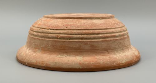 fig 7. A pair of circular Han Dynasty red terracotta pottery basins featuring broad everted rims and horizontal exterior grooves.