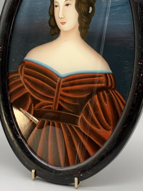 fig 5. A pair of Japanese Meiji period miniature portrait paintings in oval dark rosewood frames, depicting women in 19th-century style dresses.