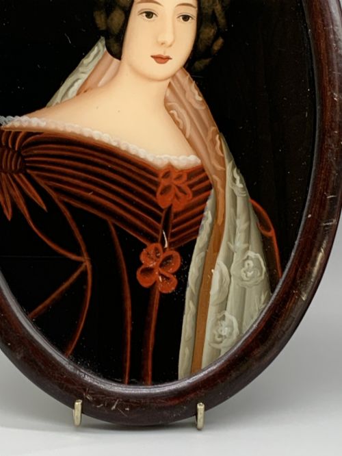 fig 7. A pair of Japanese Meiji period miniature portrait paintings in oval dark rosewood frames, depicting women in 19th-century style dresses.