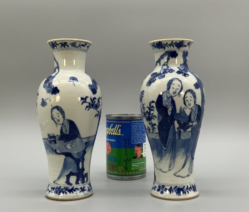 fig 2. A pair of flared Chinese blue and white porcelain vases hand painted with figural court ladies amidst floral motifs.