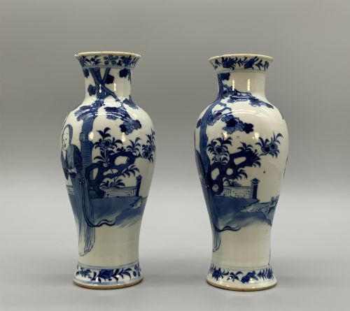 fig 3. A pair of flared Chinese blue and white porcelain vases hand painted with figural court ladies amidst floral motifs.