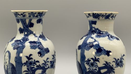 fig 4. A pair of flared Chinese blue and white porcelain vases hand painted with figural court ladies amidst floral motifs.