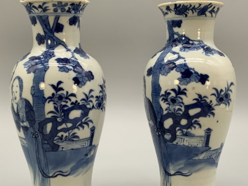 fig 5. A pair of flared Chinese blue and white porcelain vases hand painted with figural court ladies amidst floral motifs.